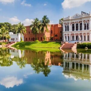 Boro Sardar Bari palace reflected in the pond at Sonargaon Folk Art and Craft Museum, a premium Trip Glider tour destination.